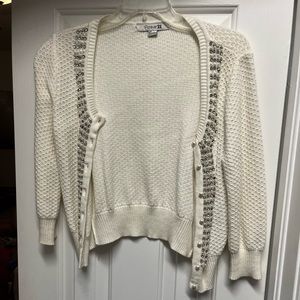 White dressy beaded cardigan.
